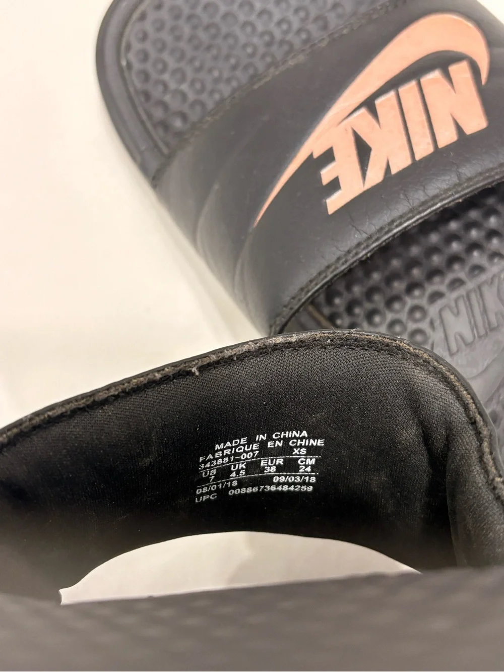 Woman’s Nike Benassi Black and Rose Gold Slides Size 7